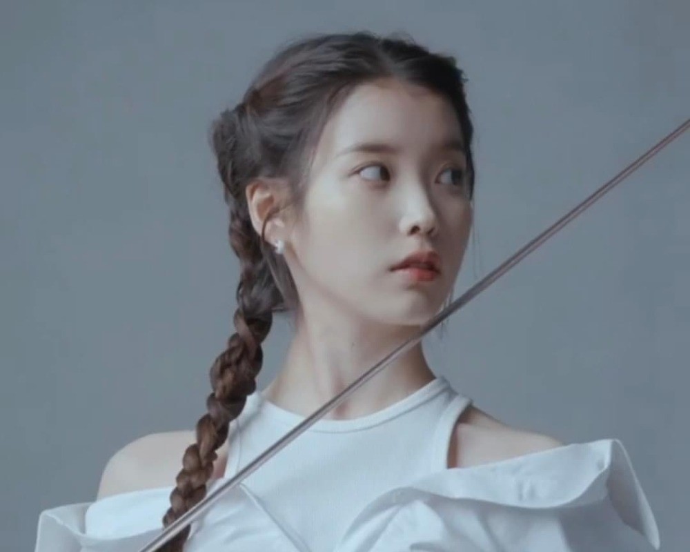 IU's fencing pictorial Vogue Korea.