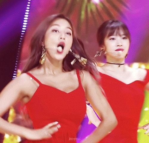 TWICE JIHYO in a red sleeveless T-shirt