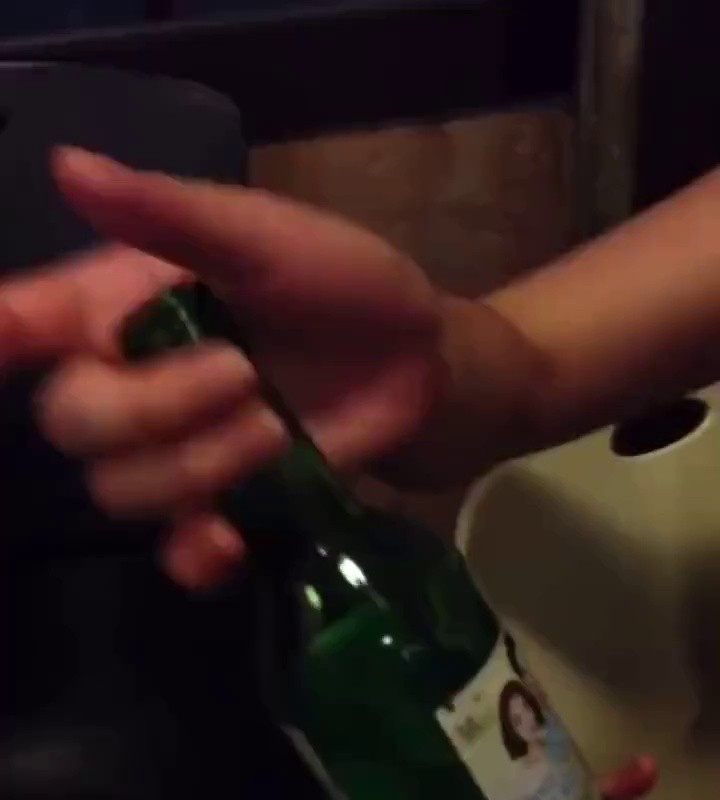 (SOUND)a wife and child fiddling with soju bottles