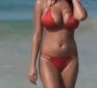 a voluminous red bikini girl