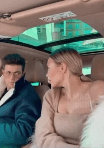 White wife gif telling her boyfriend to smell it in the car.