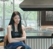 Lee Mi-joo with her arms crossed in a cool black strap