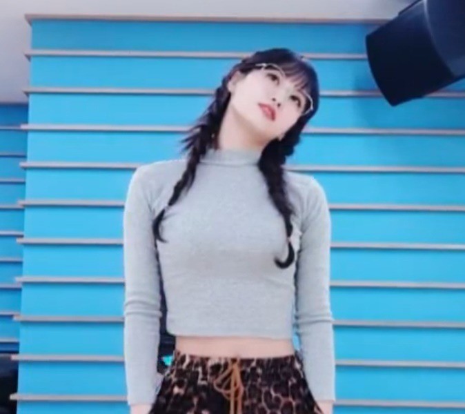 MOMO wearing gray T-shirt and leopard print pants