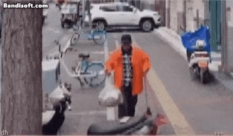 a person who dumps trash on a motorcycle