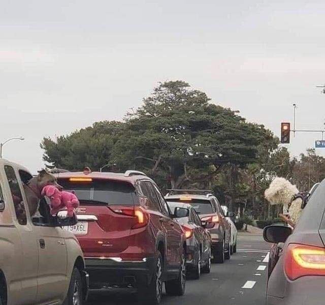 Showing off toys in the car next to you