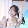 (SOUND)Suryun Suryun’s cleavage with blue suspenders and a striped tank top.