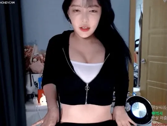 Momo88 showing off her cleavage while pulling down black velvet sweats